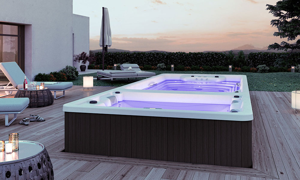 Spa de nage Swimspa BI600 illuminé par les spots couleur